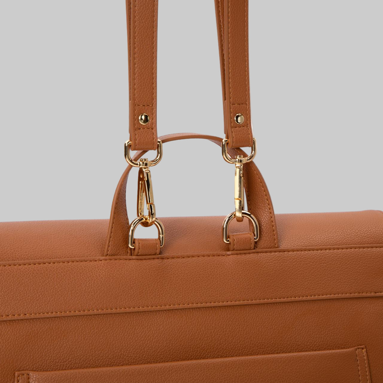 Kalos Luxe Rosey Brown diaper bag with detachable gold hooks to carry bag as a shoulder bag or back pack.