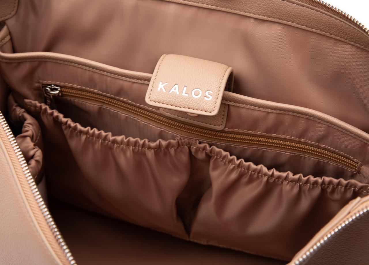 Kalos Luxe rosey taupe baby bag interior with multi compartments and padded 16-inch laptop pocket for parents on the go.
